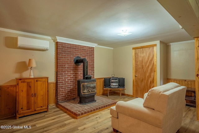 64 Coon Ln, Salem, NY 12865 - living area featuring a wall mounted air conditioner, light wood finished floors, wainscoting, ornamental molding, and a wood stove