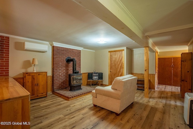 64 Coon Ln, Salem, NY 12865 - living room with a wood stove, a wall unit AC, light wood-type flooring, and crown molding