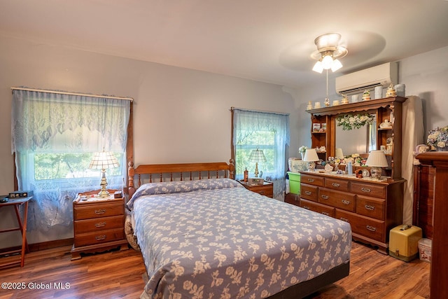 64 Coon Ln, Salem, NY 12865 - bedroom with a wall unit AC, wood finished floors, and a ceiling fan