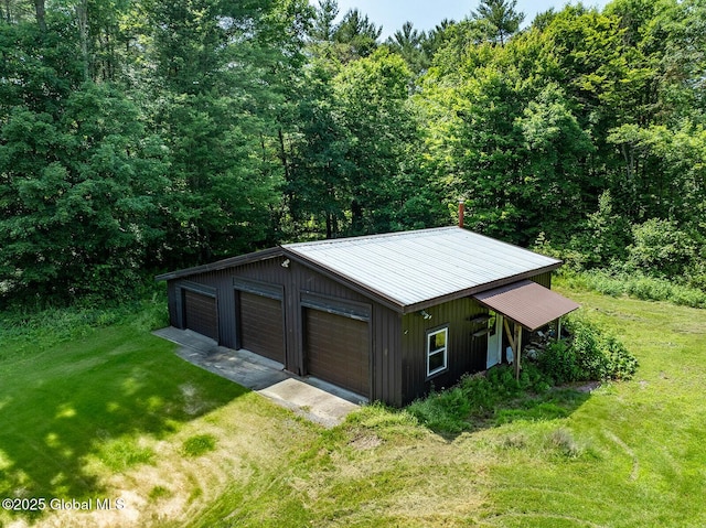 64 Coon Ln, Salem, NY 12865 - detached garage featuring a view of trees