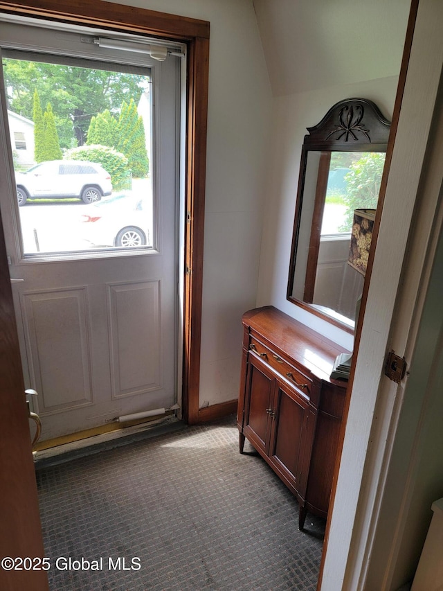 1045 Wallace Ave, Rotterdam, NY 12306 - entryway featuring healthy amount of natural light, vaulted ceiling, and carpet floors