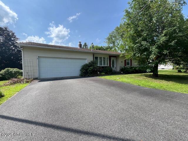 329 Schodack Dr, Schodack, NY 12033 - single story home with driveway, an attached garage, and a front lawn