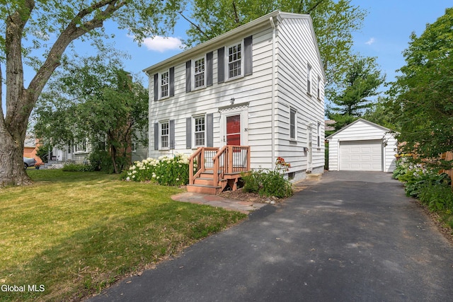 30 Crannell Ave, Bethlehem, NY 12054 - colonial house featuring an outdoor structure, a garage, asphalt driveway, and a front yard