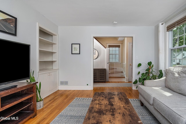 30 Crannell Ave, Bethlehem, NY 12054 - living room featuring built in shelves and wood finished floors
