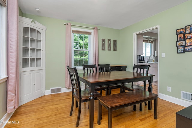 30 Crannell Ave, Bethlehem, NY 12054 - dining space with light wood-style floors and baseboards