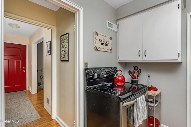 30 Crannell Ave, Bethlehem, NY 12054 - laundry area with light wood finished floors and baseboards