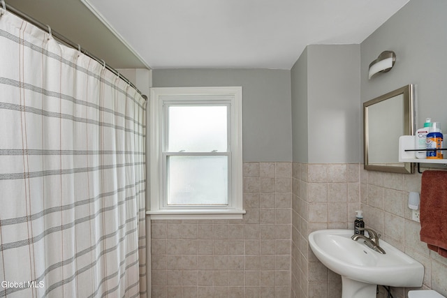 30 Crannell Ave, Bethlehem, NY 12054 - bathroom featuring tile walls, curtained shower, and a wainscoted wall