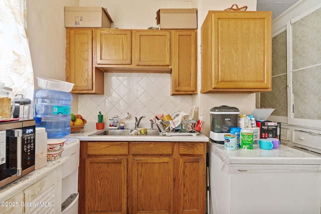 373 Delaware Ave, Albany, NY 12209 - kitchen featuring light countertops, tasteful backsplash, stainless steel microwave, and fridge