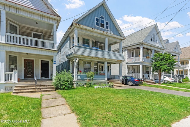 373 Delaware Ave, Albany, NY 12209 - view of front facade featuring a porch, a balcony, and a front yard
