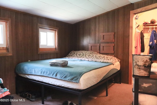 103 Seven Oaks Rd, Caroga, NY 12032 - carpeted bedroom featuring wooden walls and a spacious closet