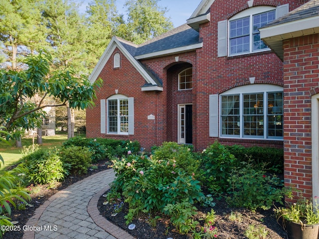 18 Beresford Rd, Clifton Park, NY 12019 - view of front facade featuring brick siding and roof with shingles