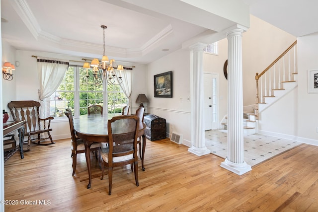 18 Beresford Rd, Clifton Park, NY 12019 - dining room with light wood finished floors, a chandelier, stairway, and crown molding