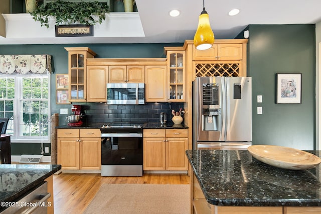 18 Beresford Rd, Clifton Park, NY 12019 - kitchen featuring stainless steel appliances, recessed lighting, light wood finished floors, decorative backsplash, and glass insert cabinets