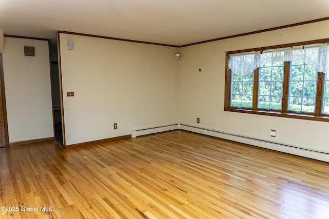 8 Burning Bush Blvd, Clifton Park, NY 12019 - spare room featuring ornamental molding, light wood finished floors, and a baseboard heating unit