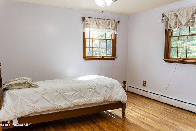 8 Burning Bush Blvd, Clifton Park, NY 12019 - bedroom with a baseboard radiator and wood finished floors