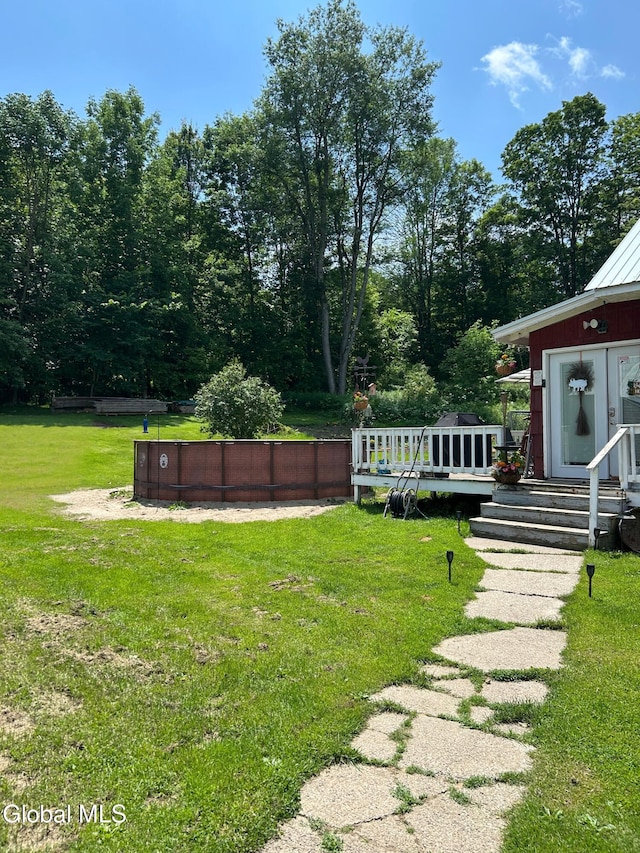 200 State Route 29a, Salisbury, NY 13454 - view of grassy yard with a pool and a wooden deck