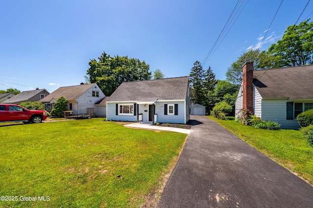 2095 Fiero Ave, Rotterdam, NY 12303 - cape cod-style house featuring an outbuilding, a front yard, and a detached garage