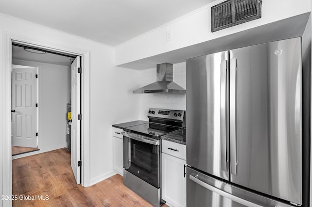 2095 Fiero Ave, Rotterdam, NY 12303 - kitchen featuring stainless steel appliances, wall chimney exhaust hood, backsplash, light wood-style flooring, and white cabinets