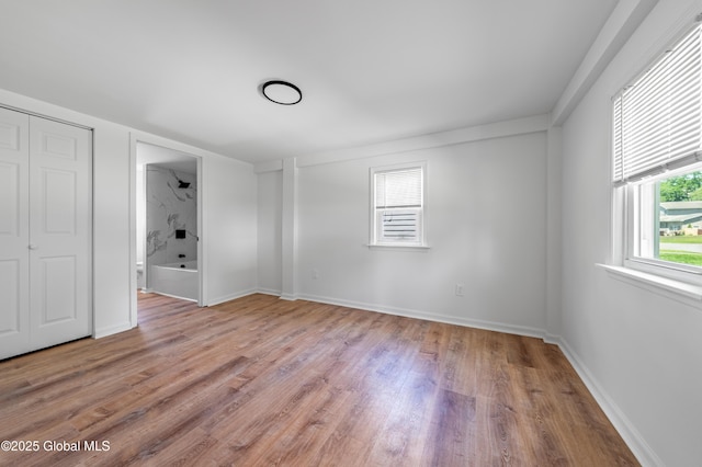 2095 Fiero Ave, Rotterdam, NY 12303 - unfurnished bedroom featuring light wood-type flooring and baseboards