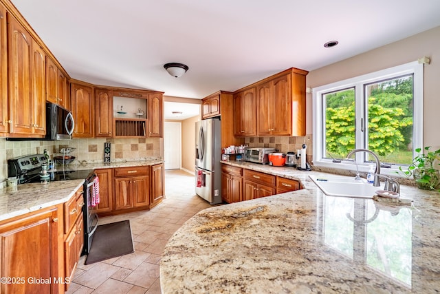 973 Avon Crest Blvd, Niskayuna, NY 12309 - kitchen featuring black electric range oven, open shelves, stainless steel fridge with ice dispenser, light stone countertops, and backsplash