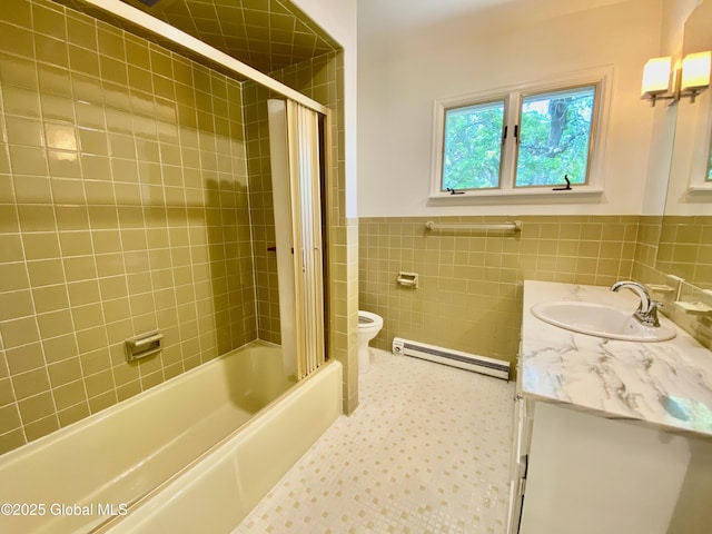 3 Olcott Ln, East Greenbush, NY 12144 - bathroom featuring a baseboard radiator, vanity, tile walls, a wainscoted wall, and washtub / shower combination