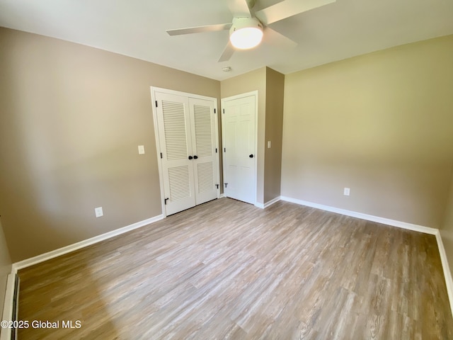 3 Olcott Ln, East Greenbush, NY 12144 - unfurnished bedroom featuring wood finished floors, a closet, and a ceiling fan