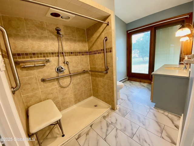 3 Olcott Ln, East Greenbush, NY 12144 - full bathroom with vanity, marble look tile flooring, a tile shower, and a baseboard heating unit