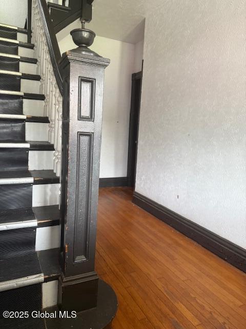 527 Pawling Ave, Troy, NY 12180 - staircase featuring baseboards and wood finished floors