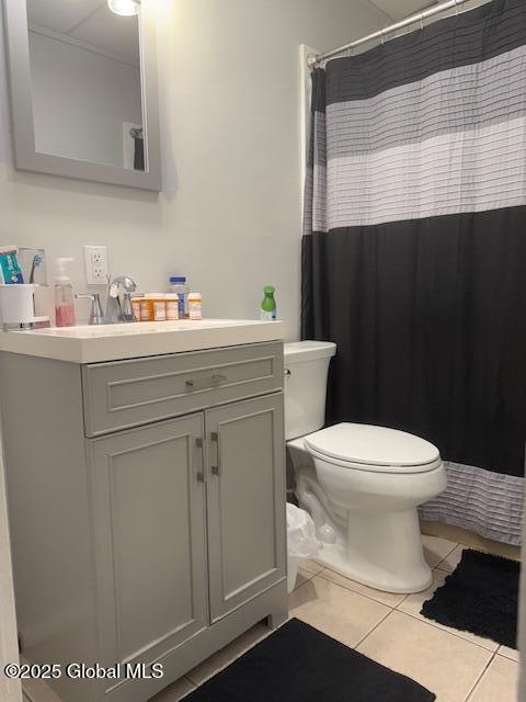 527 Pawling Ave, Troy, NY 12180 - bathroom with tile patterned floors, vanity, and curtained shower