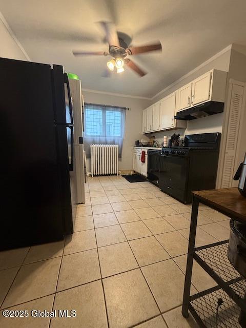 527 Pawling Ave, Troy, NY 12180 - kitchen featuring radiator, black appliances, under cabinet range hood, crown molding, and white cabinetry