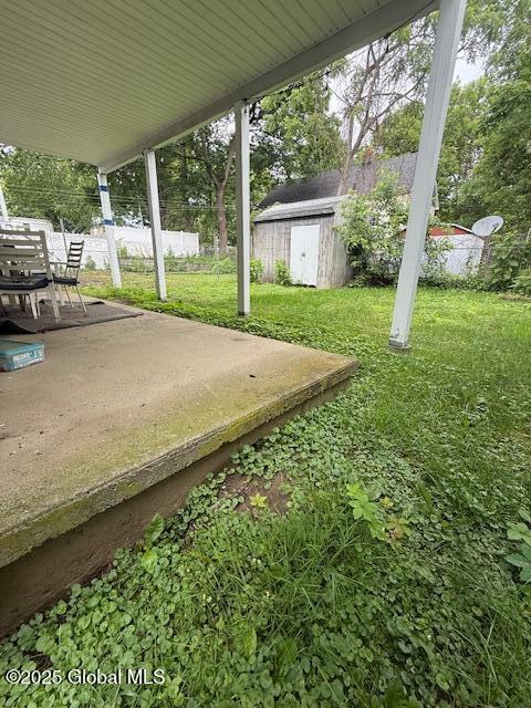 527 Pawling Ave, Troy, NY 12180 - view of yard with a patio area, a storage unit, and outdoor dining space