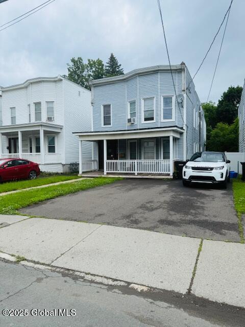 527 Pawling Ave, Troy, NY 12180 - townhome / multi-family property with covered porch and asphalt driveway