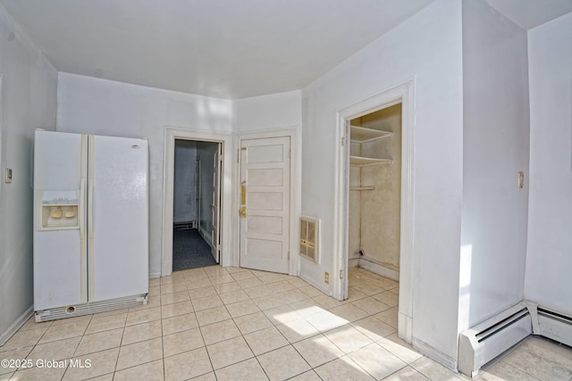 850 Peoples Ave, Troy, NY 12180 - unfurnished room featuring heating unit, light tile patterned flooring, and baseboard heating