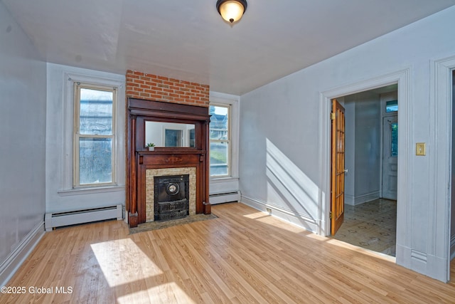 850 Peoples Ave, Troy, NY 12180 - unfurnished living room with a baseboard heating unit and wood finished floors