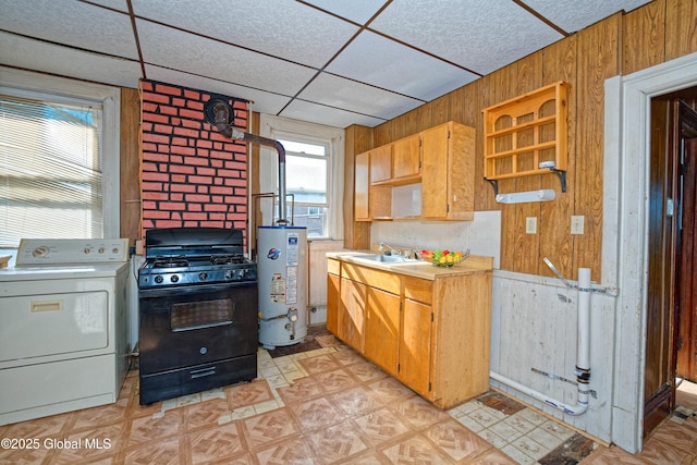 850 Peoples Ave, Troy, NY 12180 - kitchen featuring washer / dryer, black range with gas cooktop, water heater, light floors, and wooden walls