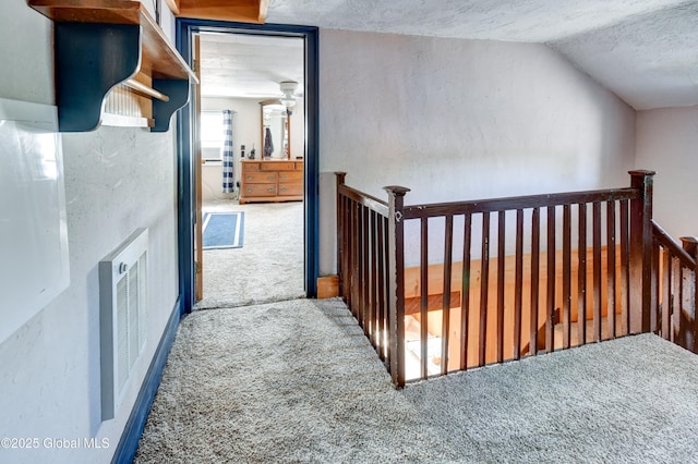 1330 State Highway 67, Johnstown, NY 12095 - corridor with carpet, an upstairs landing, a textured ceiling, lofted ceiling, and a textured wall