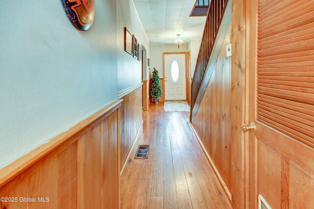 1330 State Highway 67, Johnstown, NY 12095 - doorway with light wood finished floors, wood walls, wainscoting, and stairs