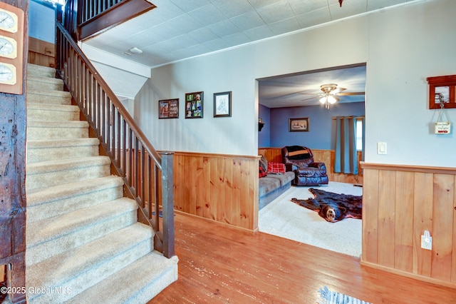 1330 State Highway 67, Johnstown, NY 12095 - stairs with wood finished floors, wainscoting, ceiling fan, crown molding, and wooden walls