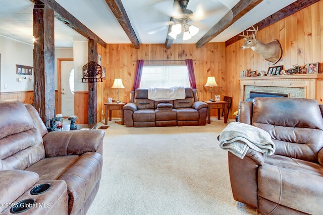 1330 State Highway 67, Johnstown, NY 12095 - carpeted living area featuring wooden walls, ceiling fan, beamed ceiling, and a fireplace