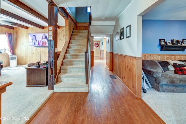 1330 State Highway 67, Johnstown, NY 12095 - staircase featuring wood walls, hardwood / wood-style flooring, and wainscoting