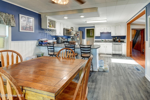1330 State Highway 67, Johnstown, NY 12095 - dining space featuring light wood-type flooring, a wainscoted wall, and crown molding