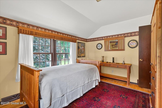 62 Pheasant Ridge Dr, Colonie, NY 12211 - bedroom featuring lofted ceiling and wood finished floors