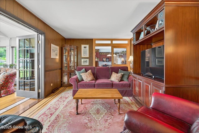 62 Pheasant Ridge Dr, Colonie, NY 12211 - living room featuring light wood-type flooring and wood walls