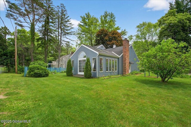 62 Pheasant Ridge Dr, Colonie, NY 12211 - view of property exterior with a chimney