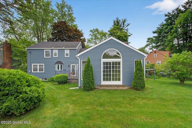 62 Pheasant Ridge Dr, Colonie, NY 12211 - back of property featuring a lawn and a wooden deck