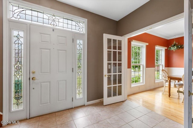 14 Maplecrest Dr, Ravena, NY 12143 - entrance foyer with light tile patterned flooring and a chandelier