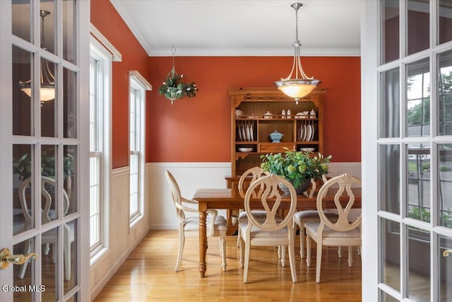 14 Maplecrest Dr, Ravena, NY 12143 - dining space with ornamental molding, wainscoting, wood finished floors, and french doors