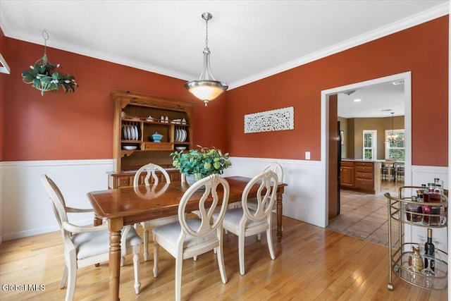 14 Maplecrest Dr, Ravena, NY 12143 - dining area with wainscoting, light wood-type flooring, and ornamental molding