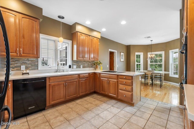 14 Maplecrest Dr, Ravena, NY 12143 - kitchen featuring black appliances, a peninsula, tasteful backsplash, decorative light fixtures, and recessed lighting