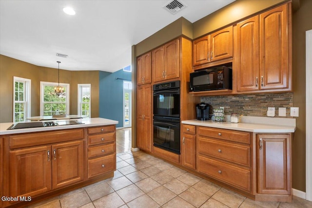 14 Maplecrest Dr, Ravena, NY 12143 - kitchen featuring black appliances, brown cabinets, tasteful backsplash, and light countertops